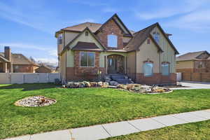 Craftsman house featuring a gate, stucco siding, a shingled roof, and stone siding