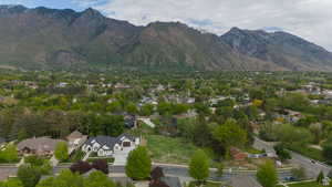 Aerial perspective of suburban area featuring a mountain backdrop