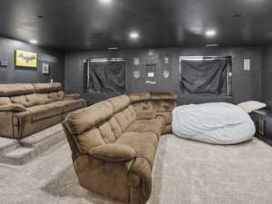 Home theater featuring carpet and recessed lighting