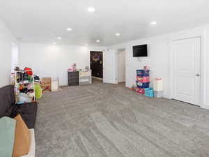 Recreation room featuring carpet and recessed lighting