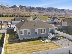Aerial perspective of suburban area with a mountainous background