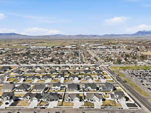 Aerial view of residential area featuring a mountain backdrop