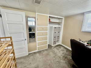 Office area with light colored carpet and baseboards