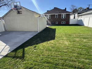 Rear view of property with stucco siding and brick siding
