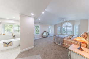 Bedroom with crown molding, light carpet, and ceiling fan