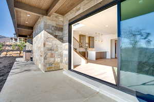 Property entrance featuring stone siding
