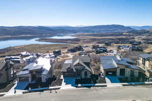 Aerial perspective of suburban area featuring a water and mountain view