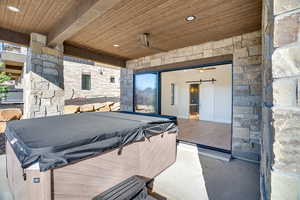 View of patio featuring a hot tub
