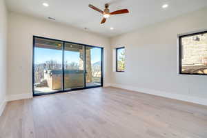 Unfurnished room with ceiling fan, light wood finished floors, and recessed lighting