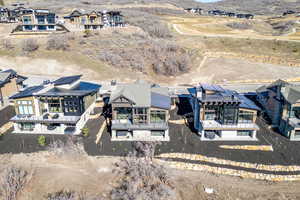 Aerial perspective of suburban area with a mountain backdrop
