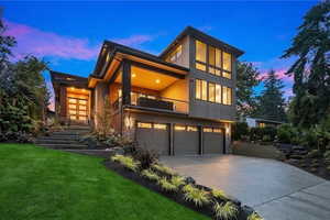 Example of a potential home design utilizing the natural slope of the lot, allowing for a drive-under garage and elevated main living space without extensive excavation.