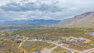 Aerial perspective of suburban area featuring a mountainous background