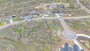 Aerial view of property's location featuring nearby suburban area
