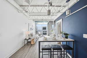 Dining room featuring light wood-style floors and baseboards