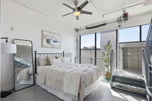 Bedroom featuring concrete floors and ceiling fan
