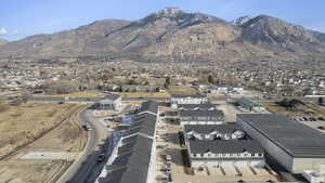 Aerial perspective of suburban area with a mountain backdrop