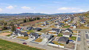 Aerial view of residential area featuring a mountainous background