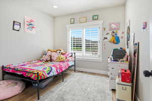Bedroom featuring light wood finished floors and recessed lighting