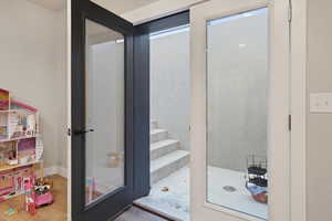 Bathroom with a stall shower and light wood-type flooring