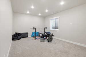 Workout room with carpet and recessed lighting