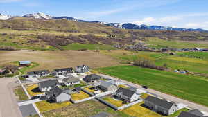 Aerial view of residential area featuring a mountain backdrop