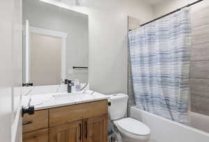 Bathroom with vanity and shower / bath combination with curtain