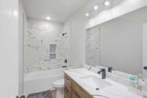 Full bathroom featuring vanity and shower / bath combination
