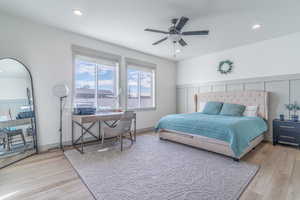 Bedroom featuring light wood-type flooring, ceiling fan, and recessed lighting