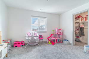 Recreation room with light colored carpet