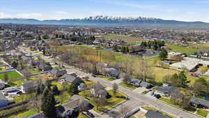 Aerial perspective of suburban area with a mountain backdrop
