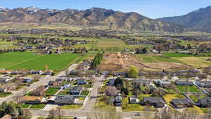 View of property location with nearby suburban area and mountains