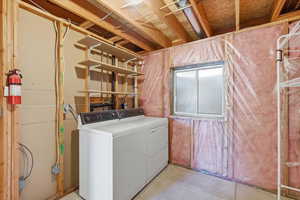 Laundry room featuring separate washer and dryer