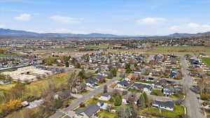 Aerial perspective of suburban area featuring a mountainous background