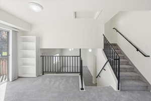 Stairway with attic access and carpet floors