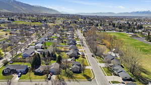 Aerial view of residential area featuring a mountain backdrop