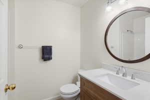 Bathroom featuring vanity and toilet