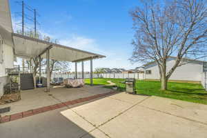Fenced backyard with a patio area, grilling area, a residential view, and outdoor lounge area
