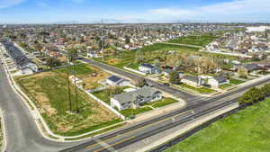 Aerial perspective of suburban area featuring a mountain backdrop