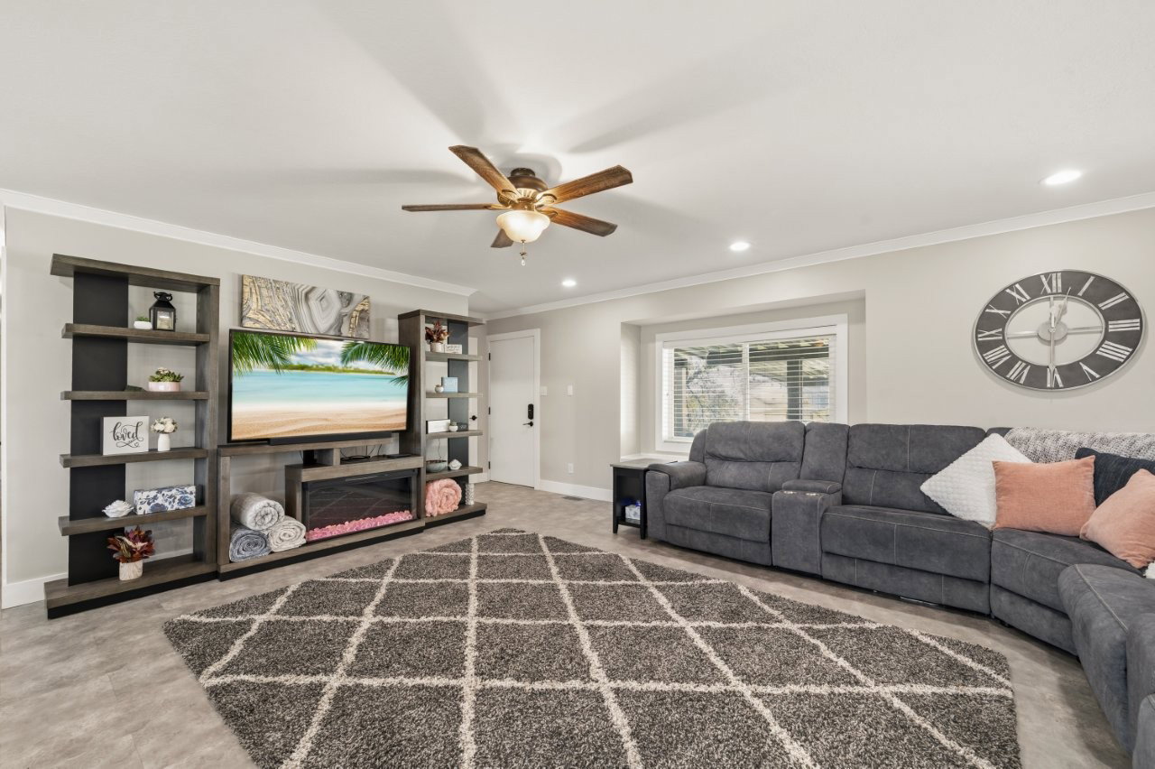 Living area ,ceiling fan, and recessed lighting