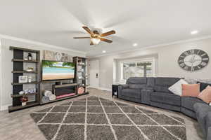 Living area ,ceiling fan, and recessed lighting