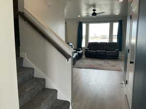 Entryway with a ceiling fan, recessed lighting, light wood-type flooring, and a textured ceiling