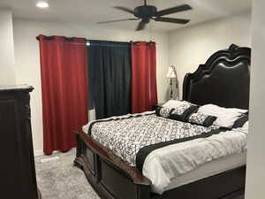 Bedroom with light carpet and ceiling fan