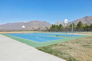 View of sport court with community basketball court and a mountain view