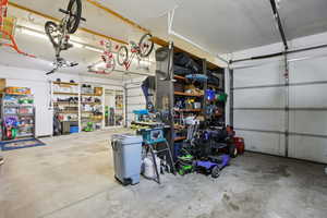 Garage featuring freestanding refrigerator