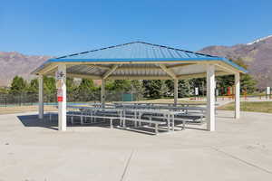 View of home's community featuring a mountain view, a gazebo, and a patio area