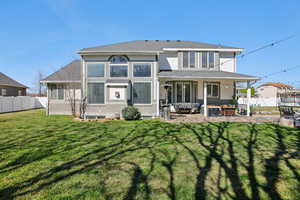 Rear view of house featuring an outdoor living space, stucco siding, and a patio