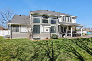 Rear view of property with a patio, a shingled roof, and stucco siding