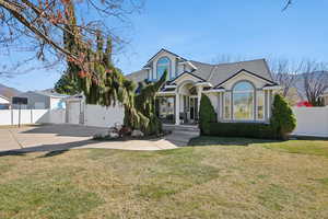 View of front facade featuring driveway, stucco siding, an attached garage, and a shingled roof