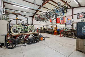 Garage with bike storage and a workshop area