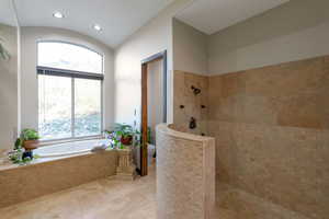 Full bath featuring a walk in shower, a garden tub, and recessed lighting